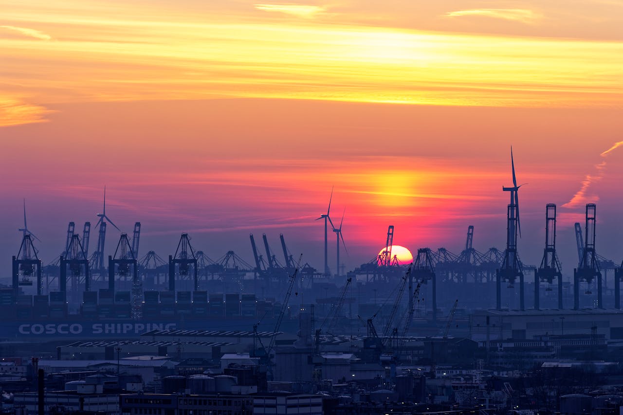 COSCO vessel in a port at sunset