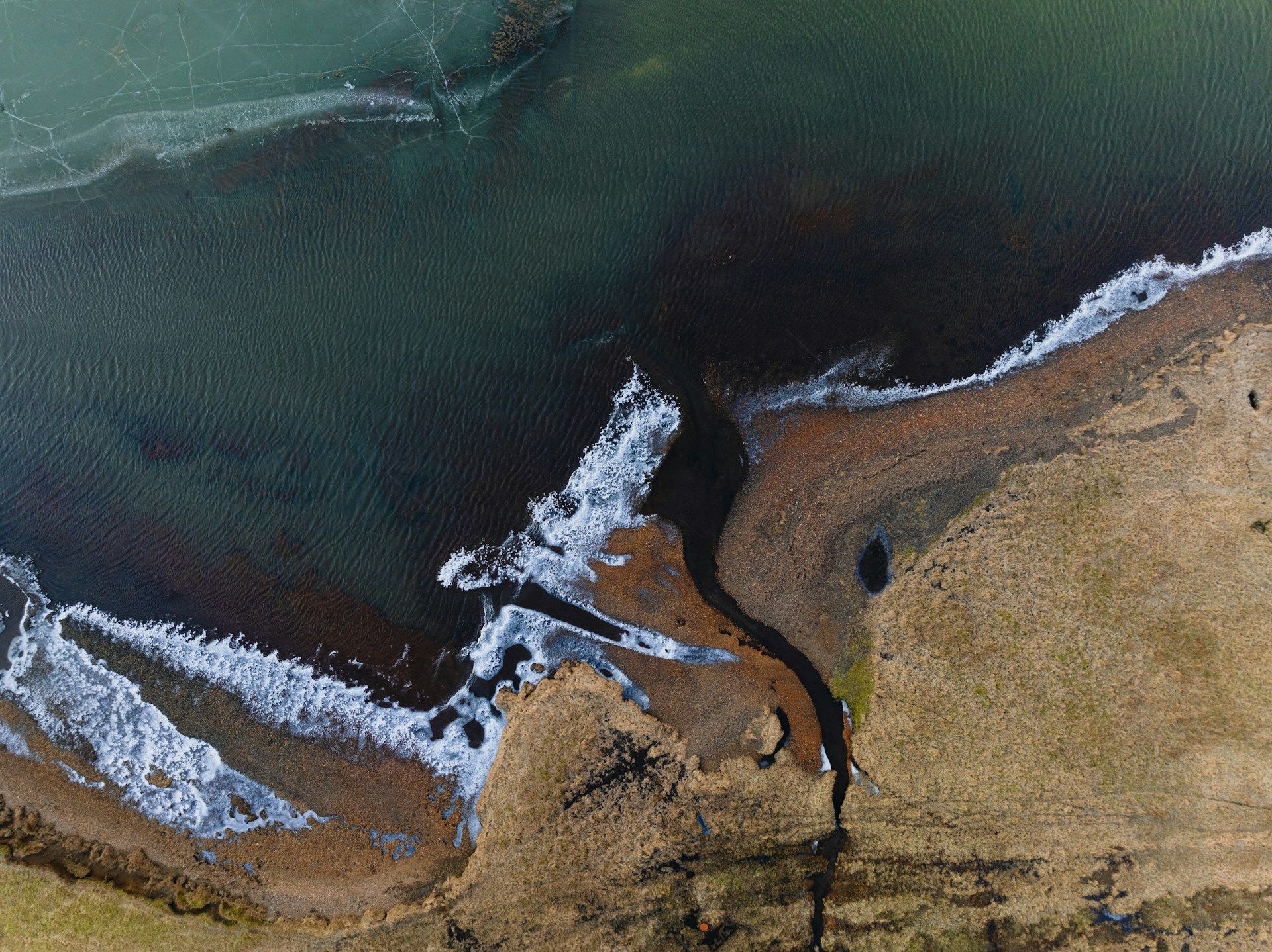 Aerial view of an oil spill on a coastline