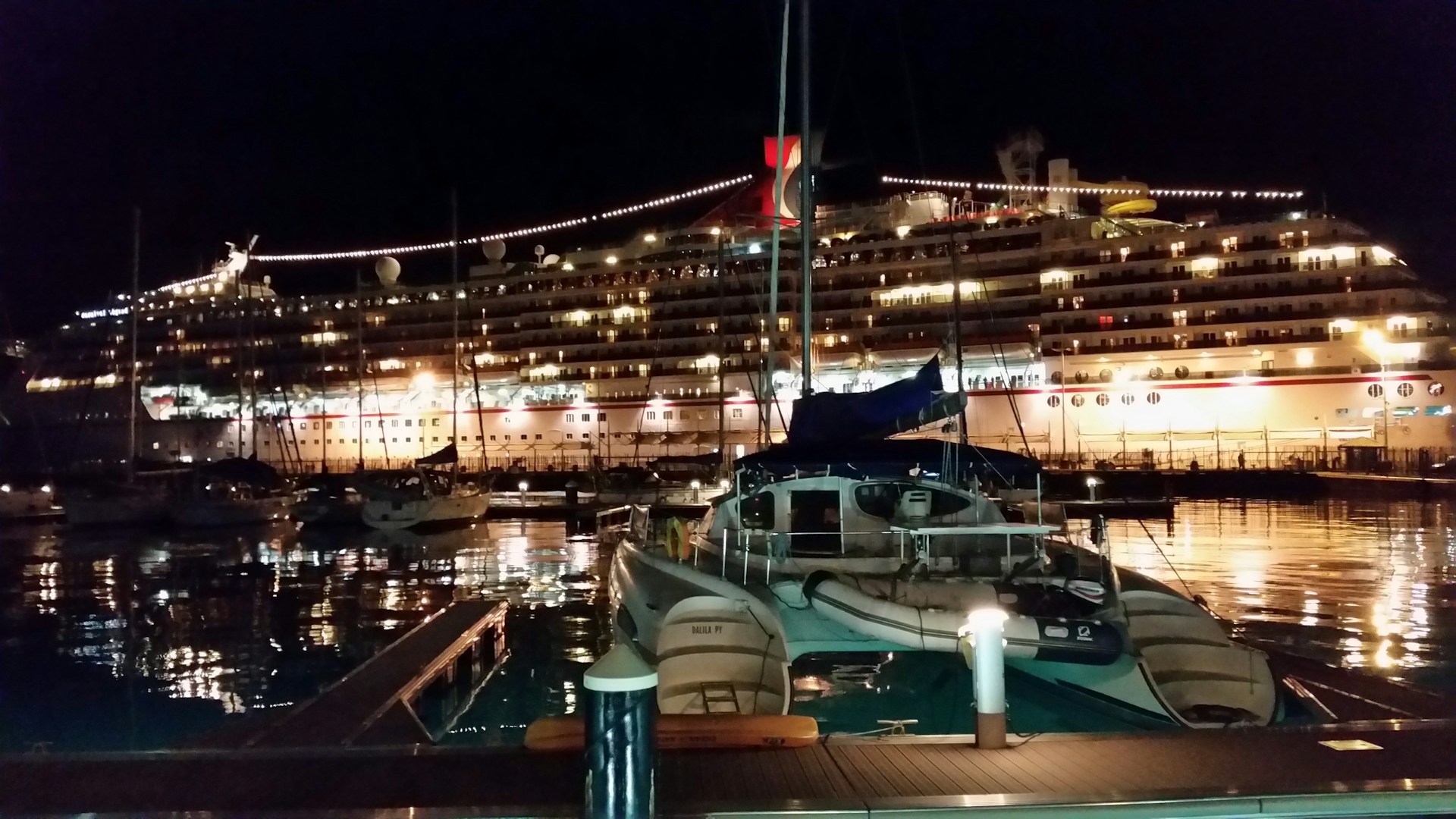 A Carnival cruise ship in port at night