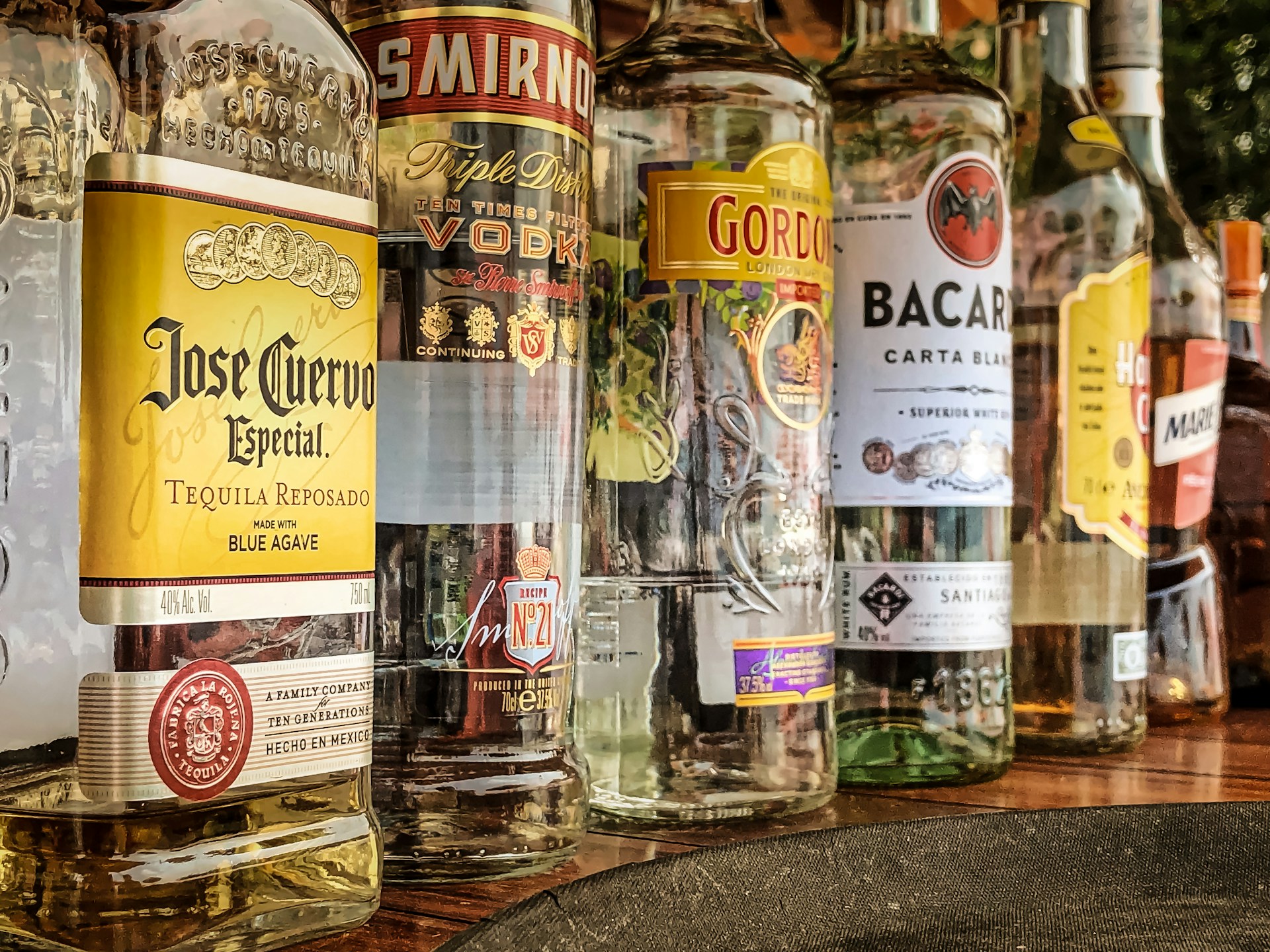 A row of spirits in bottles