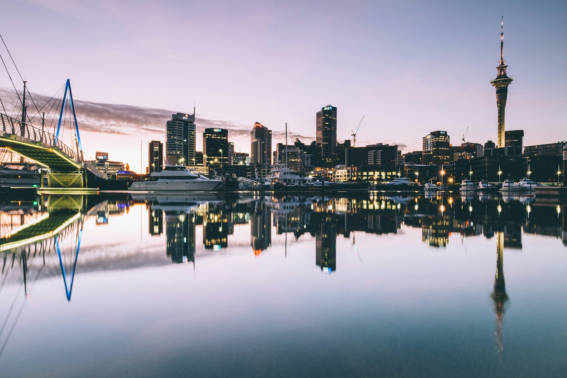 Boats in Auckland harbor at dusk