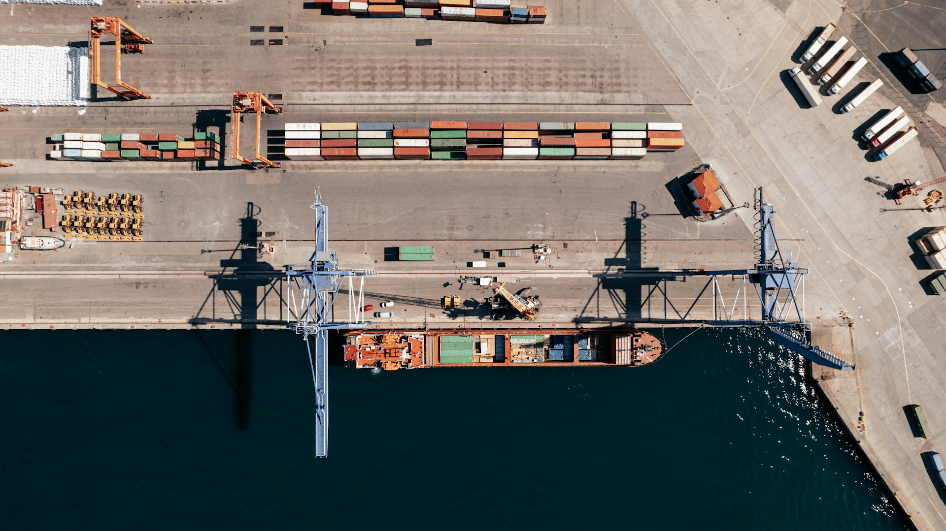 an aerial view of cranes in a container terminal