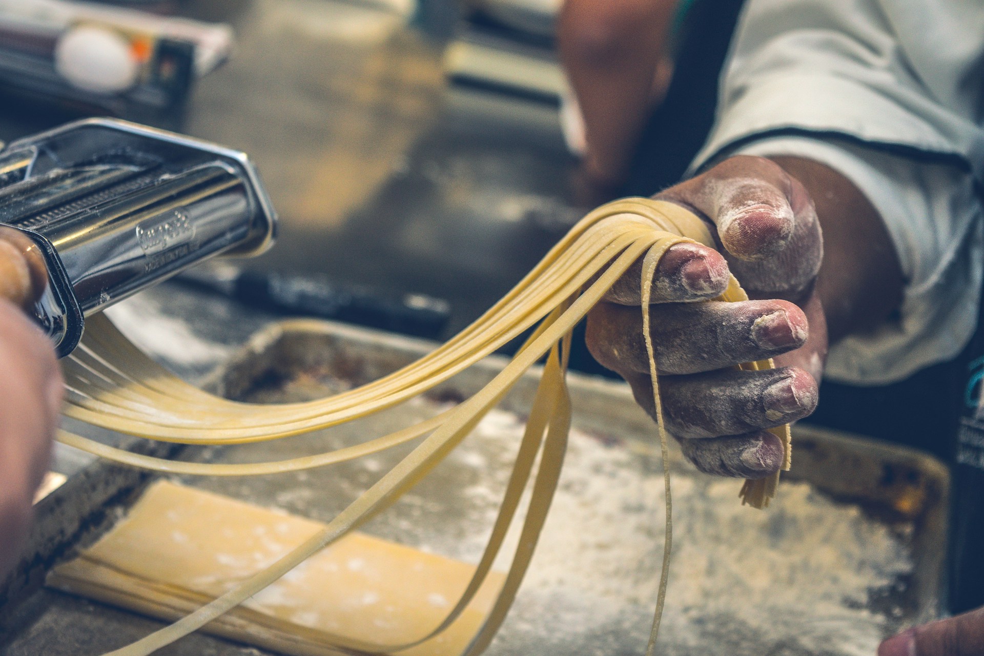 A chef making pasta by hand