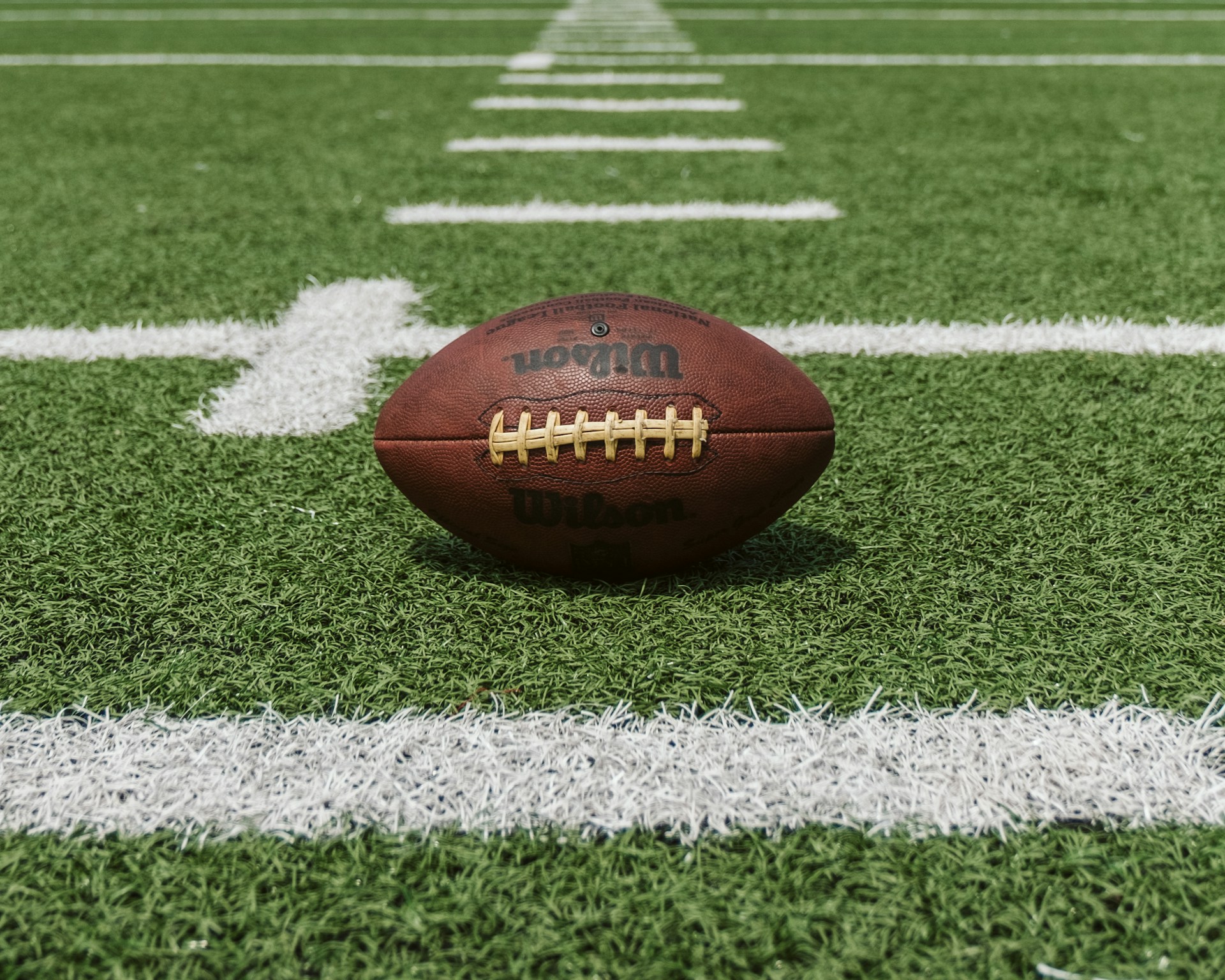 An American football on a pitch