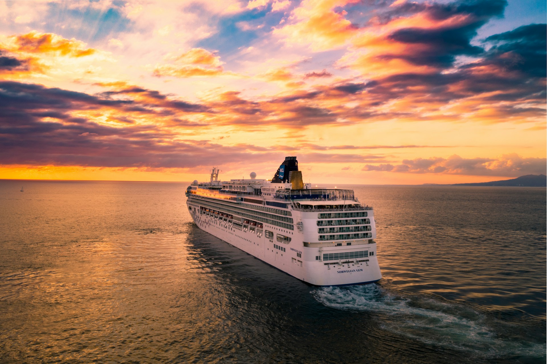 The Norwegian Gem cruise ship at sunset