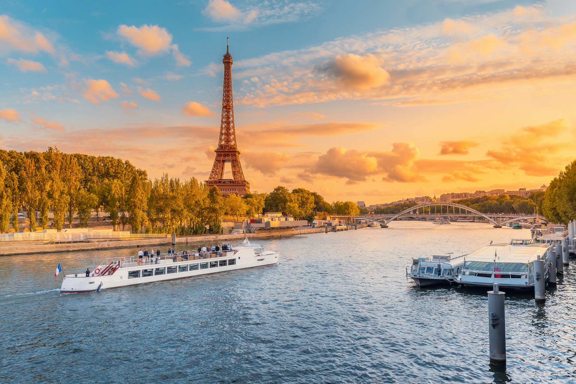 A river cruise boat on the River Seine at sunset