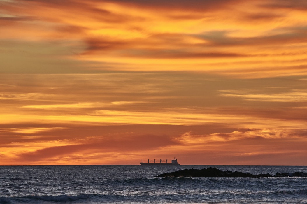 bulk carrier silhouette at sunset