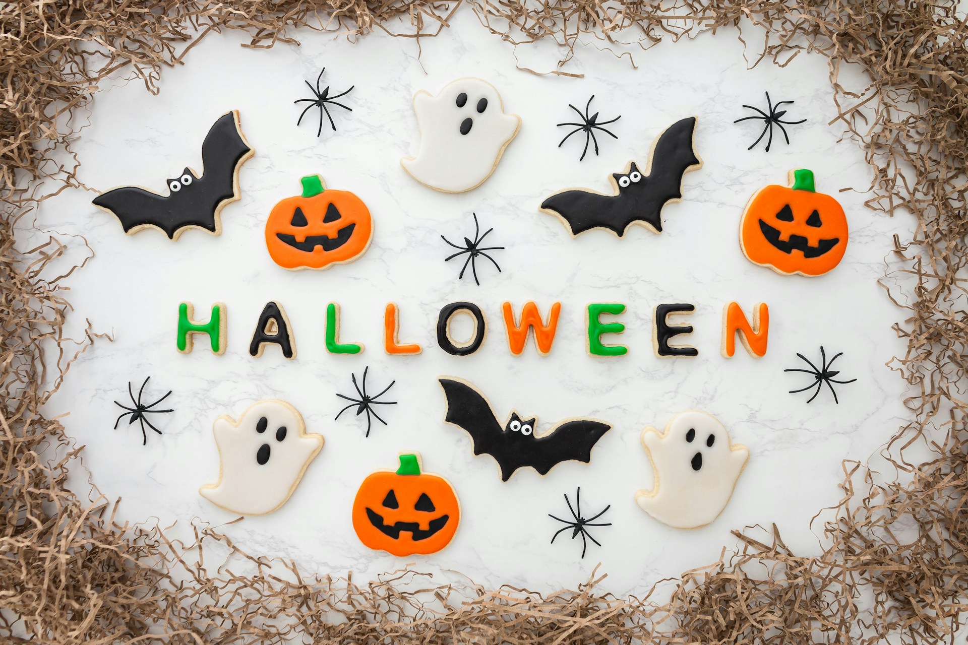 Halloween cookies shaped like ghosts, bats and pumpkins