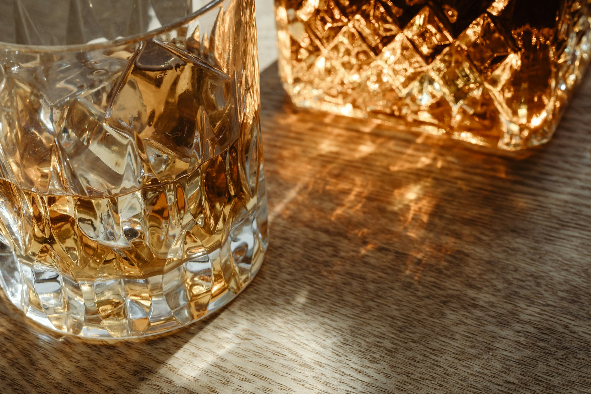 A whisky tumbler and decanter