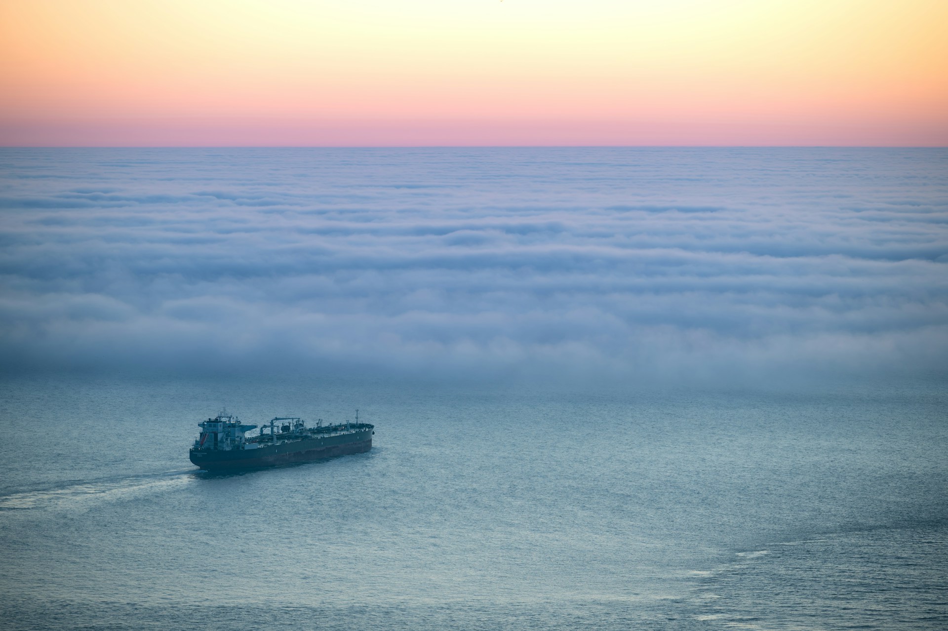 Oil tanker at sunset