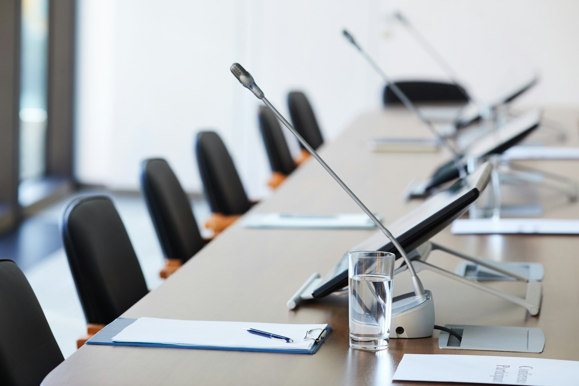 A table and chairs in a corporate boardroom