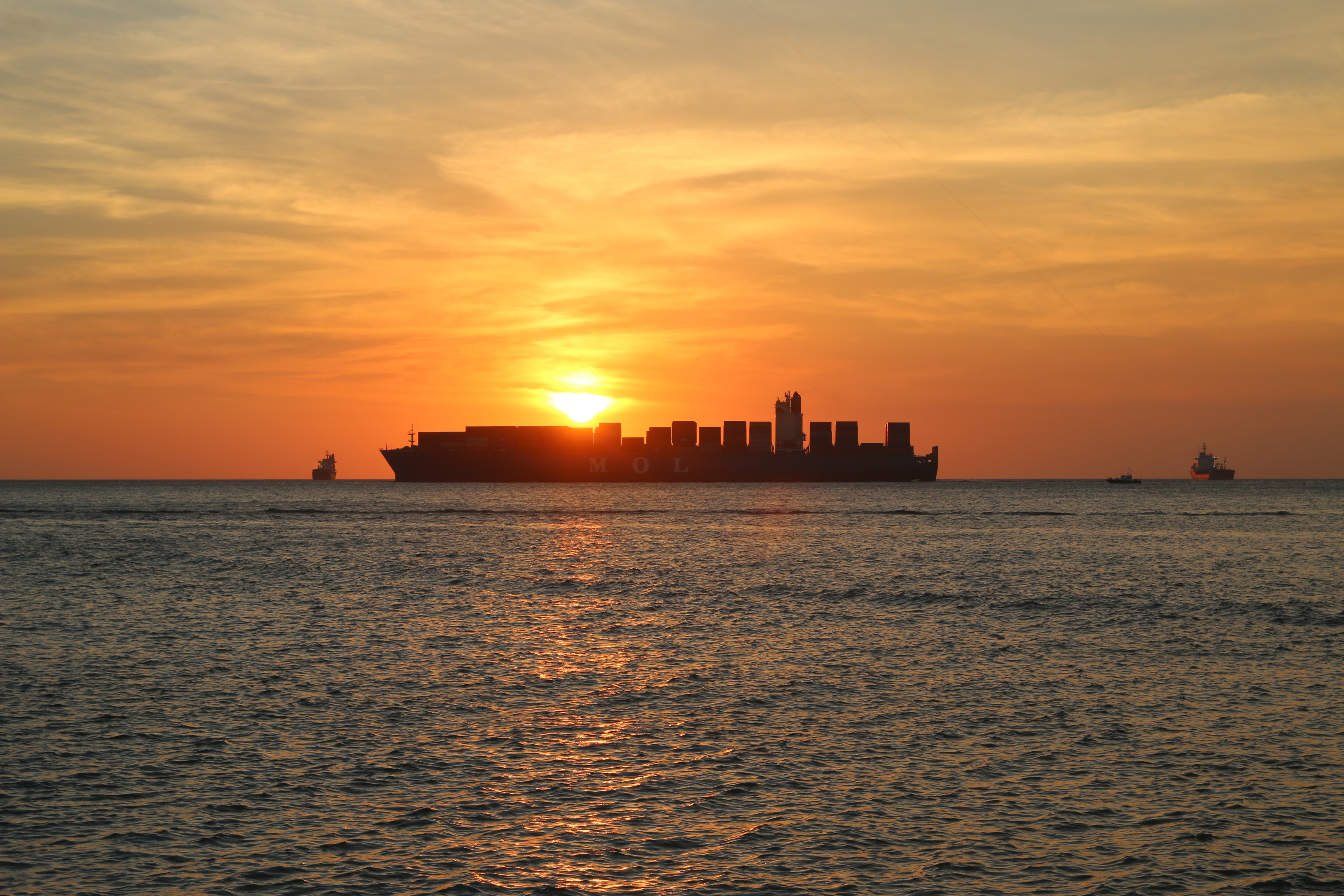 A container ship at sunset