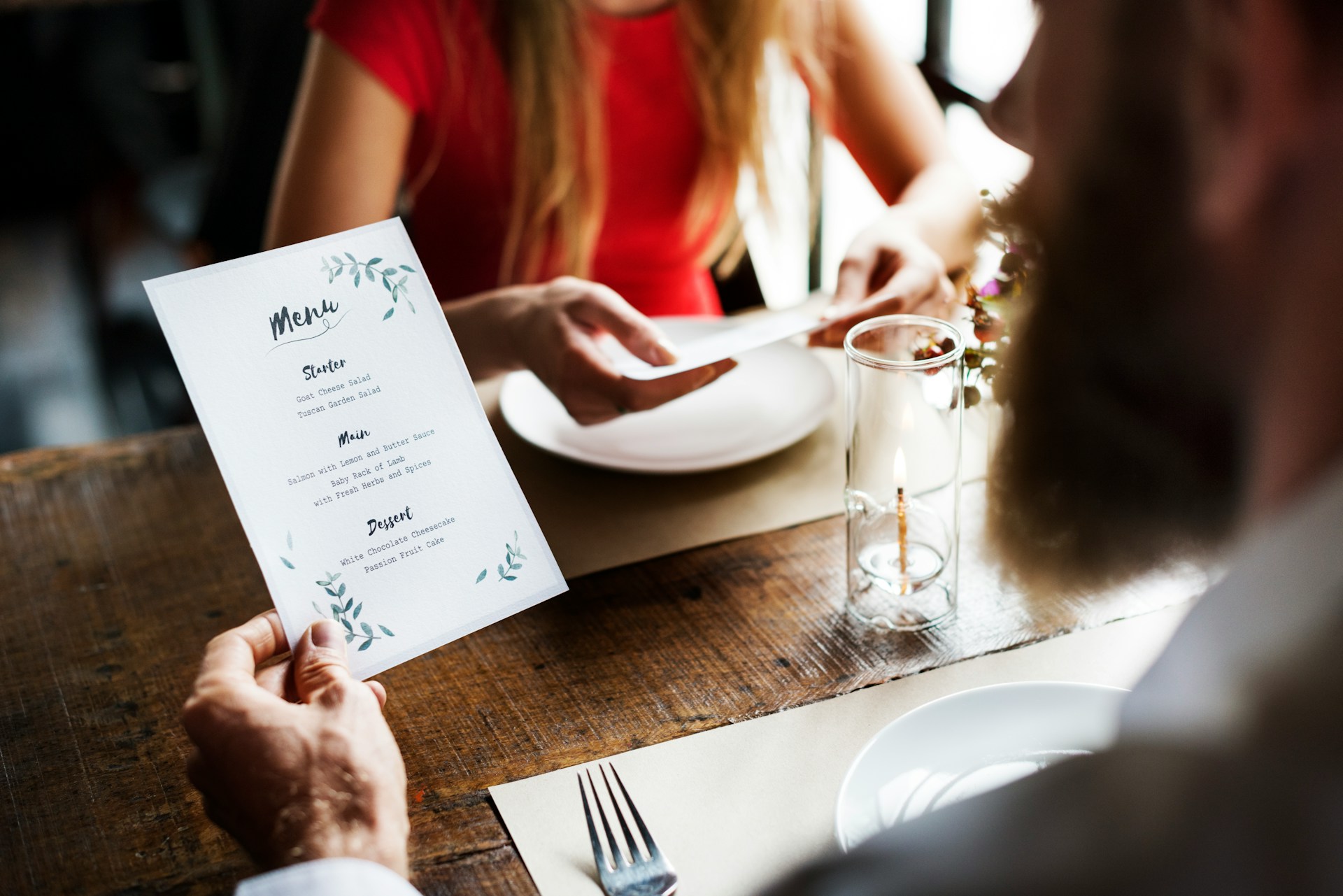 Diners looking at a menu in a restaurant