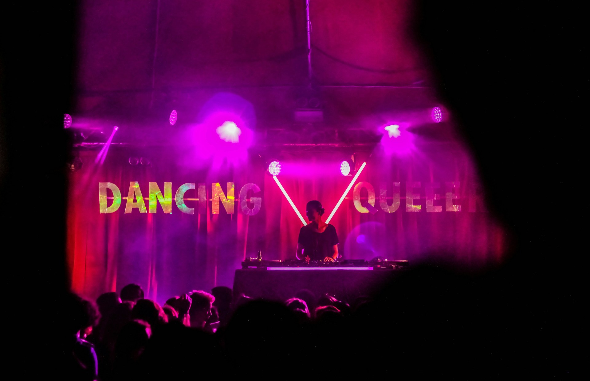 A DJ performing at a disco