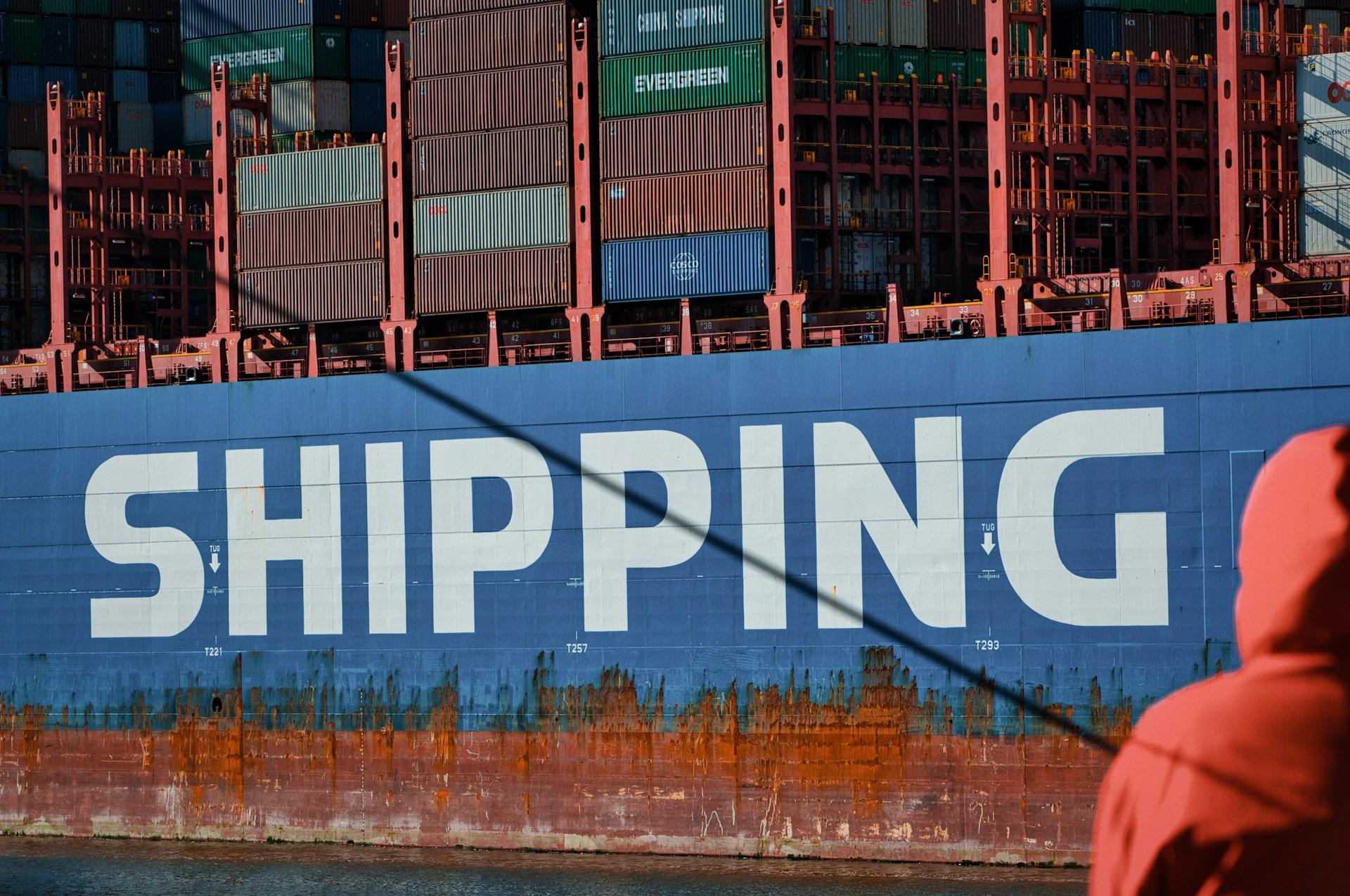 Close up of the COSCO Shipping logo on the side of a container ship