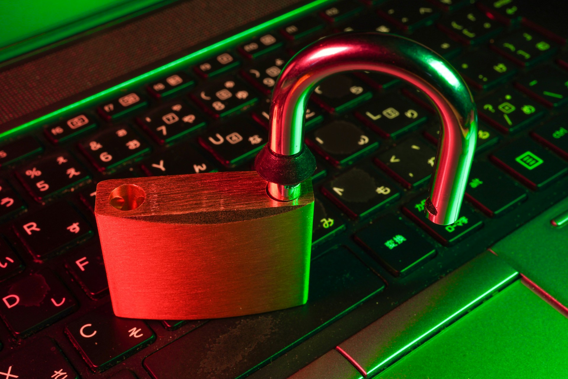 An open padlock on a computer keyboard