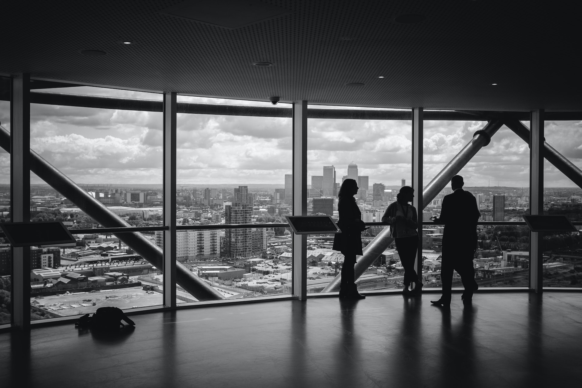 People in office overlooking city skyline