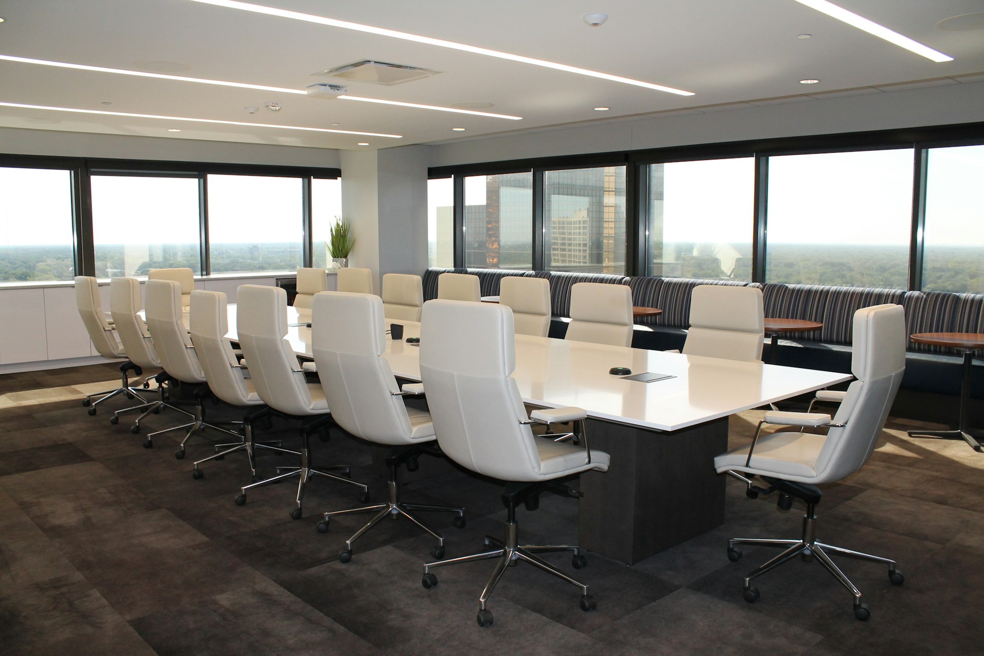 A corporate boardroom table and chairs