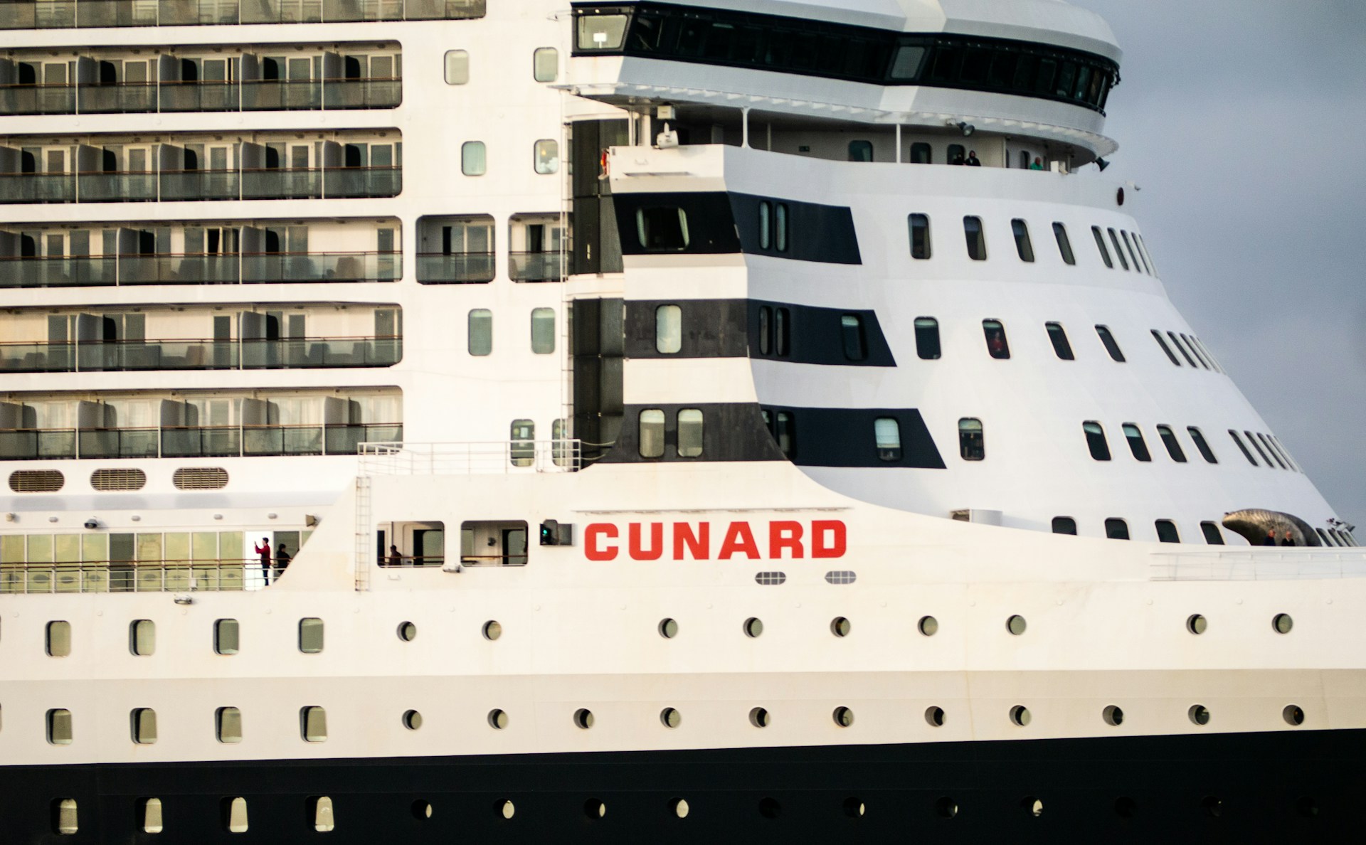 The Cunard logo on the side of a cruise ship