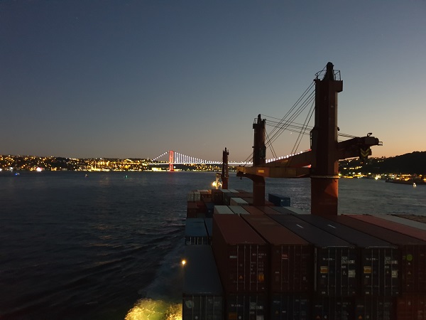 Vessel sailing the Bosphorus Strait at dusk