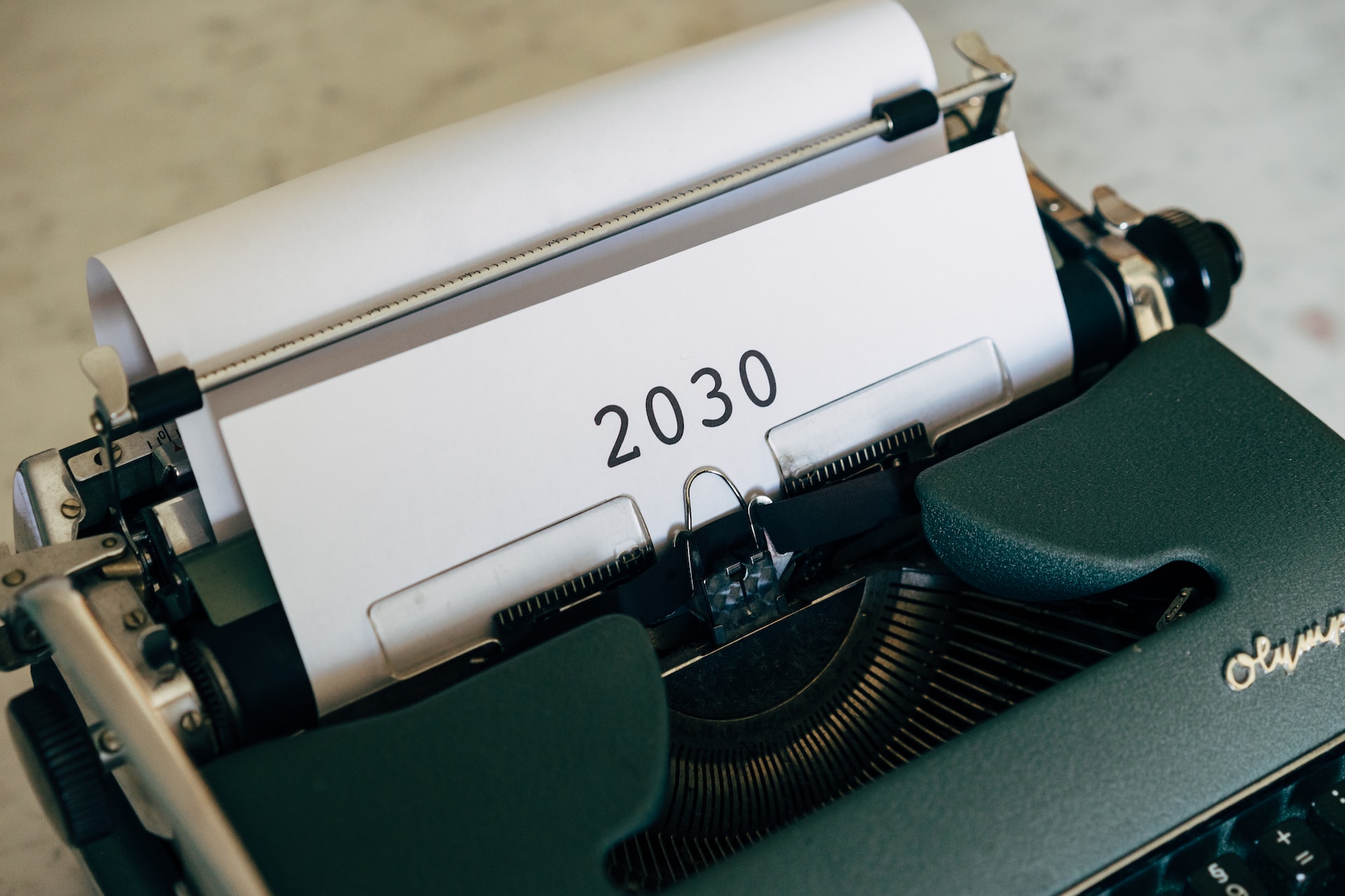 Typewriter with 2030 types onto a piece of paper in its roller