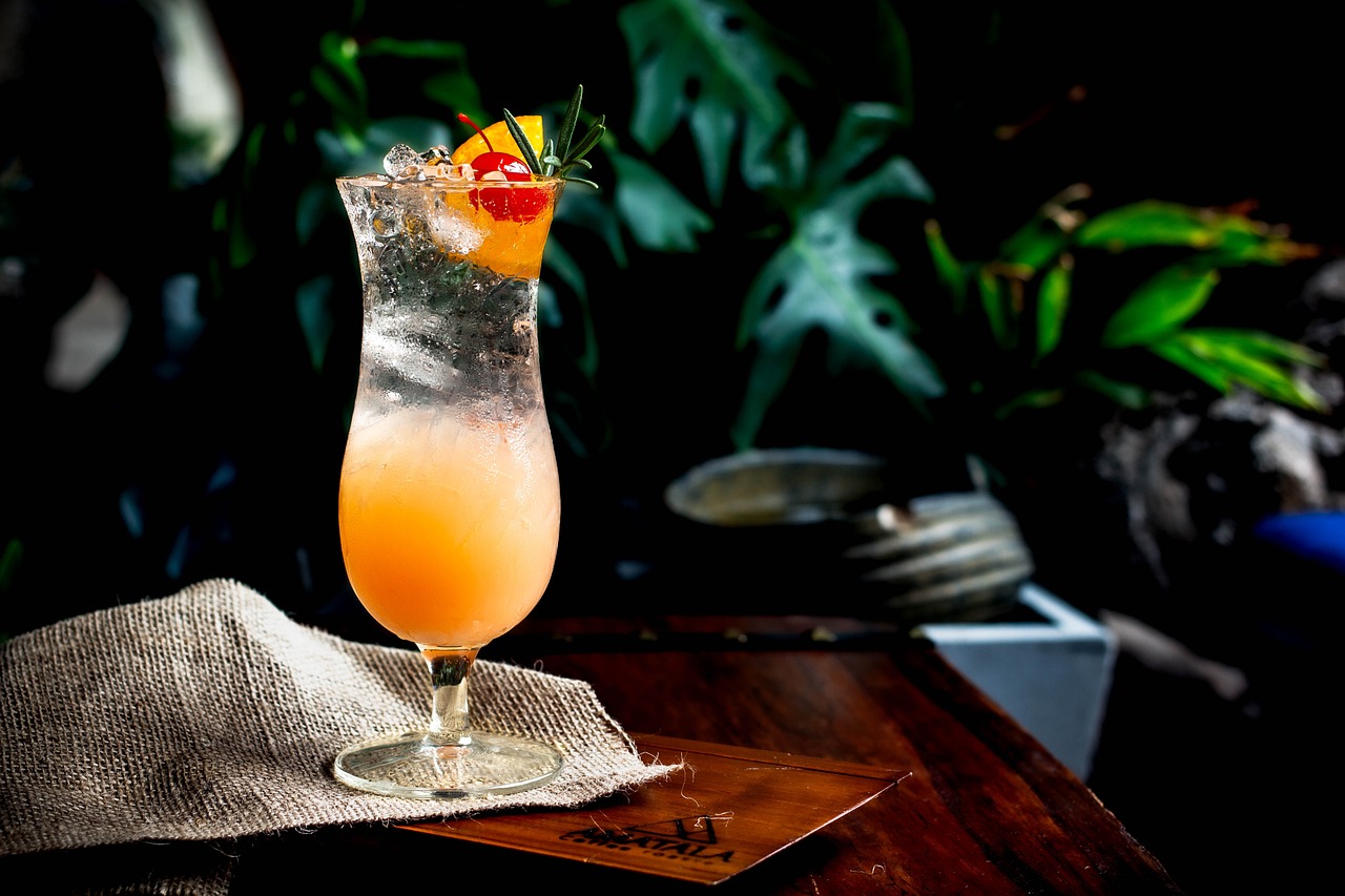 A cocktail surrounded by greenery