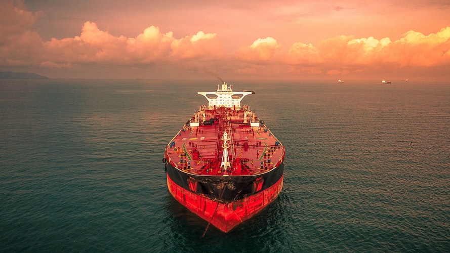 Oil tanker at sunset