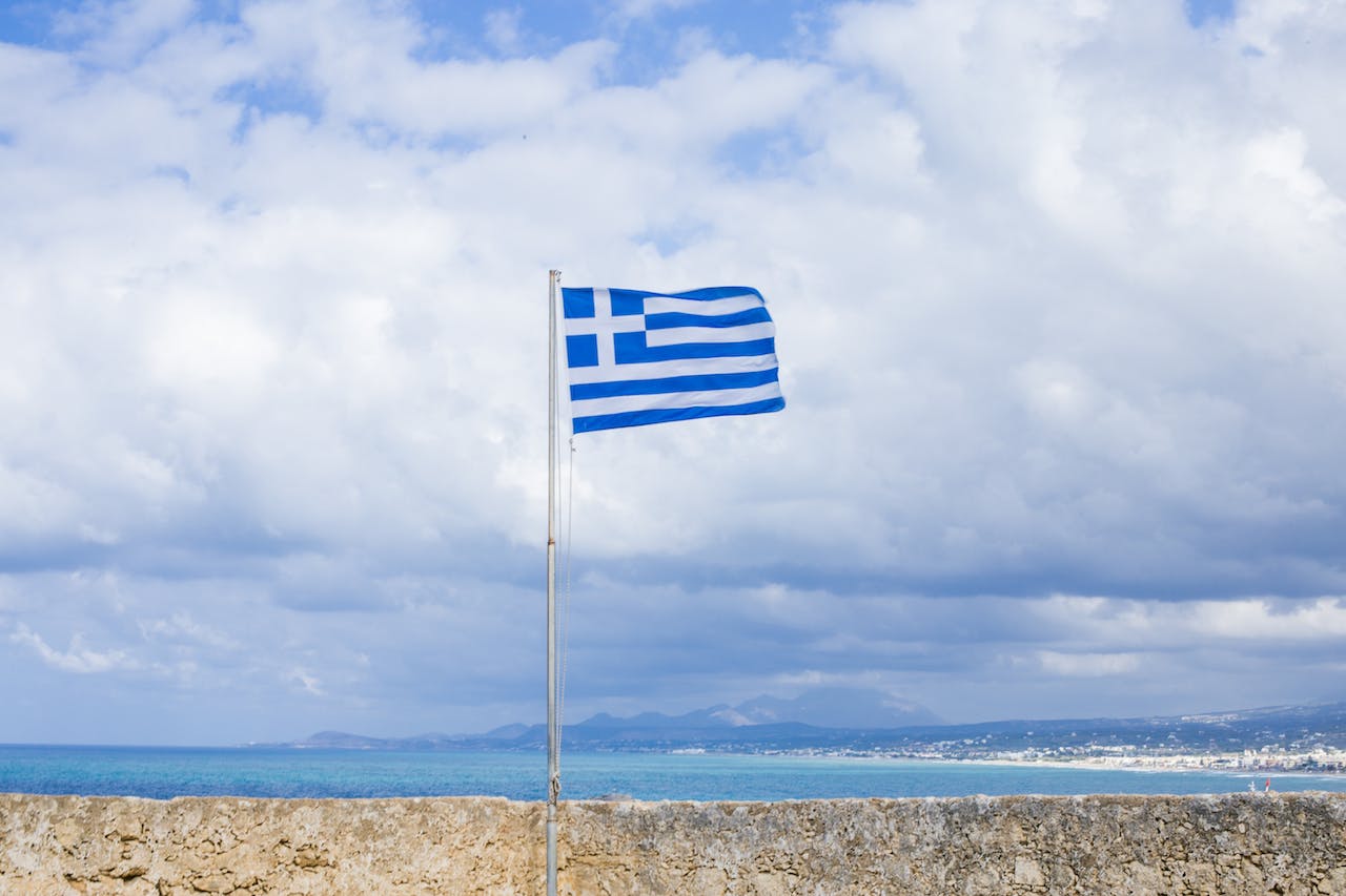 The Greek flag on a beach