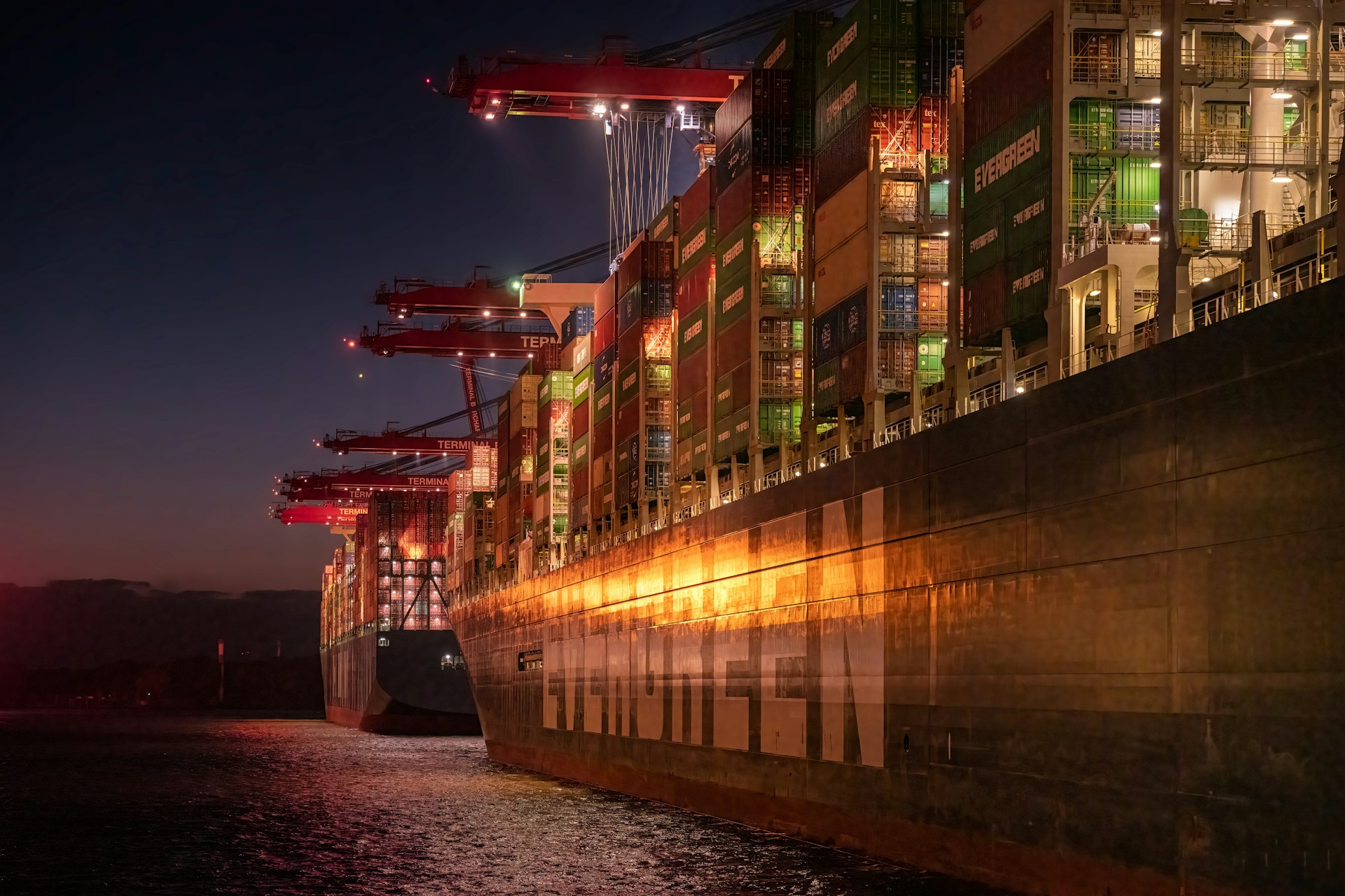 An Evergreen containership at night
